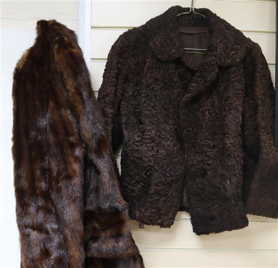 A mink coat and two fur capes